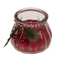 Kerze im Glas mit Weihnachts-Dekoration,