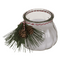 Kerze im Glas mit Weihnachts-Dekoration,